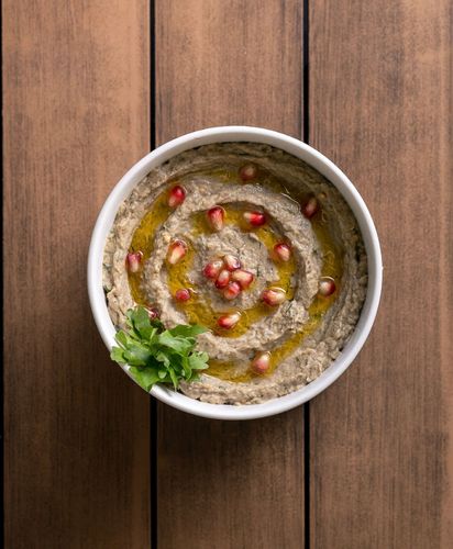 Baba Ghanouch - Delicious grilled eggplant carefully seasoned with Tablia's special mixture, tahini, garlic and olive oil.