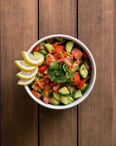 Green Salad - Egyptian green salad consisting of a rich and refreshing mix of Fresh Vegetables with special spices.