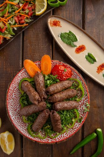 Kofta - 3 Skewers of kabab meat grilled with special recipe of tabliah, served with fresh French fries, tahini sauce