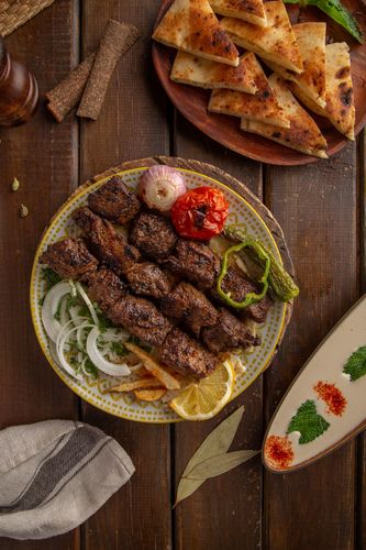 Meat Kabab - 3 Skewers of tika made from tenderloin meat grilled, served with fresh French fries, tahini.