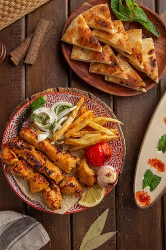 Shish Tawook - CHICKEN THIGH WITH EGYPTIAN RECIPE served with Garlic Sauce, Fries ,Bread and Mixed Pickles