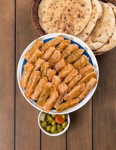 Cabbage Large - 25 pieces of stuffed cabbage rolls stuffed with a mixture of rice, spices, sauce and leafy vegetables with a unique Egyptian taste.