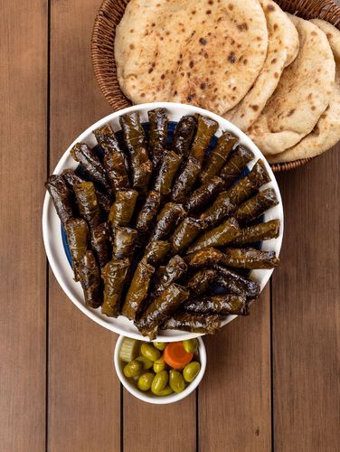 Vine Leaves Large - 25 pcs vine leavesVine leaves stuffed with a delicious rice mixture with tomatoes, parsley, olive oil and lemon sauce.
