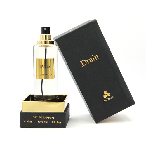 Drain - The Drain perfumeA fragrance of freshness, vitality and happiness, from the acidity of yellow lemon. The fragrance of our luxurious fragrance begins to sail in the world of refined musk with the air breeze saturated with pure ozone in a calm harmony that draws a smile and happiness on the faces of those who inhale it.50ML