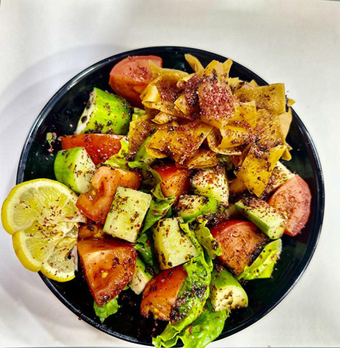 Fattoush - It consists of tomatoes, cucumbers, lettuce and mint with pomegranate sauce and olive oil, in addition to toasted bread