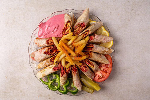 large Arabic plate - 4 sandwiches, two pieces of shamyat, with garlic sauce, fries and cola