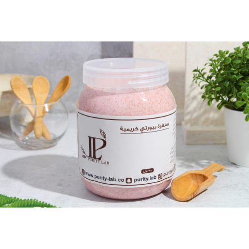 Purity Lab - Purity Creamy Scrub - It contains kojic acid and is fortified with lightening extracts. Moisturizing is very high after rinsing to improve it. It works to unify the skin color and remove dark spots in the body, while continuing to open and lighten the skin naturally. Size: 500 G How to use: After soaping, spread a layer of sandpaper on the skin and leave it for 3-5 minutes Then rub it gently in a circular way, then rinse with lukewarm water Use as desired daily or on leave