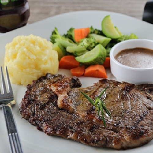 Angus Steak / Rib Eye Steak - Grilled Rib Eye steak 310g , mashed potato, mix veg, served with our homemade mushroom gravy sauce.