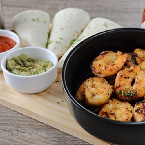 Shrimp Fajita - Grilled shrimp fajita, sautéed onion & mix capsicum serve with tortilla bread fresh guacamole & marinara.