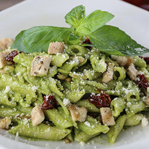 Pesto Pasta - Fettuccini pasta, chicken, spinach, sundried tomato, homemade pesto sauce topped with grated parmesan served with garlic bread.