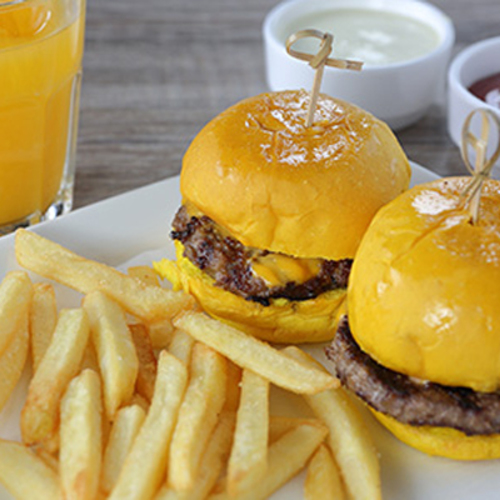 Kids Beef Burger - Two sliders of beef berger sandwish served with fries and fresh orange juice.