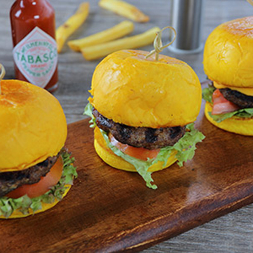 Beef Sliders - Grilled angus beef, serve with lollo rosso, tomato, creamy cheddar cheese with home made zephora special sauce.