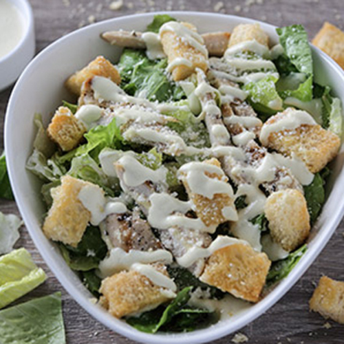 Chicken Caesar Salad - Romaine lettuce with parmesan cheese, crotons served with homemade caesar sauce.