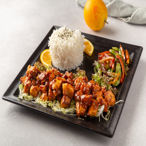 Orange Chicken - 400grm deep fried chicken , covered with sweet and spicy orange sauce , served with rice and sauté vegetable in soya sauce , enough for two person.