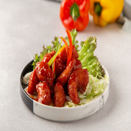 Spicy Dynamite Shrimp - Pieces of Shrimp with buffalo sauce.