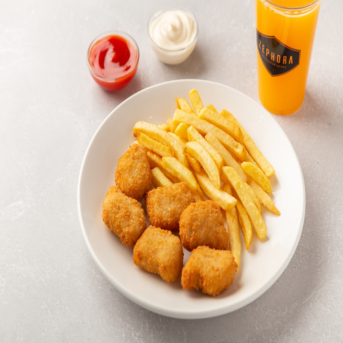 Chicken Nuggets - 6 Pieces of chicken nuggets served with french fries and orange juice.