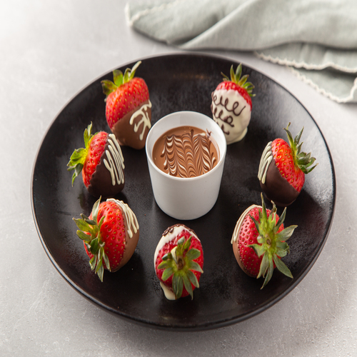 Strawberry Delight - 7 pieces of fresh strawberries dipped in 3 kind of chocolates served with chocolate dipping.