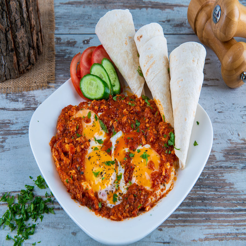 Shakshoka - Sunny Side Up Egg with mix Tomato Sauce ,herbs and spicies with tortilla on the side