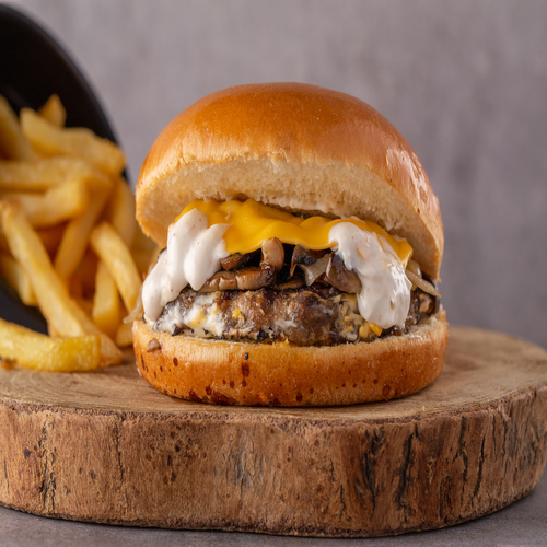 Mushroom Burger - Grilled angus beef , mushrooms ,onion, creamy cheddar cheese with garlic , mayo sauce.