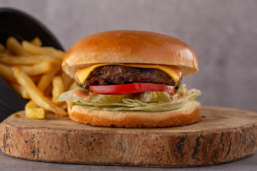 Classic Zephora Burger - Grilled minced beef with cheddar cheese, tomato, pickles, iceberg lettuce & our special zephora sauce.