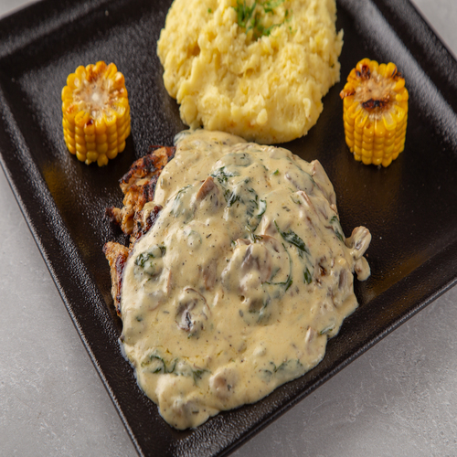 Creamy Grilled Chicken - Creamy grilled chicken filled with mushrooms, spinach sauce served with mashed potato and corn.