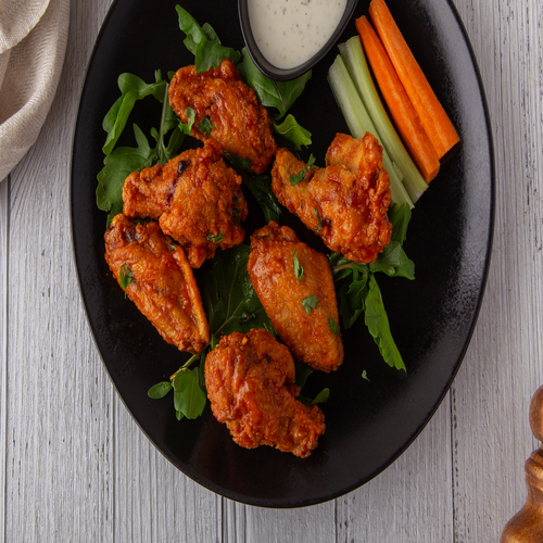 Chicken wings - 6 pieces of chicken wings with homemade  spicy buffalo sauce , served with ranch sauce