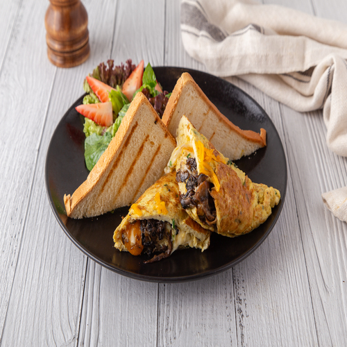 Portobello omelet - Sautee portobello mushrooms with cheddar & mozzarella cheese , with side of salad