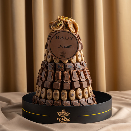 Cocoa Tower The roof 2 - برج كاكاو مع طباعة الاسم كيلو و٦٠٠ جرام عبارة عن حشوات مختلفة برلين ، كرمل مكسرات ،كاكاو كرانشي ، رهش كاكاو مزينه بالتين المجفف الرجاء كتابة الاسم بالملاحظات اسم الى أسمين فقط⚠️
