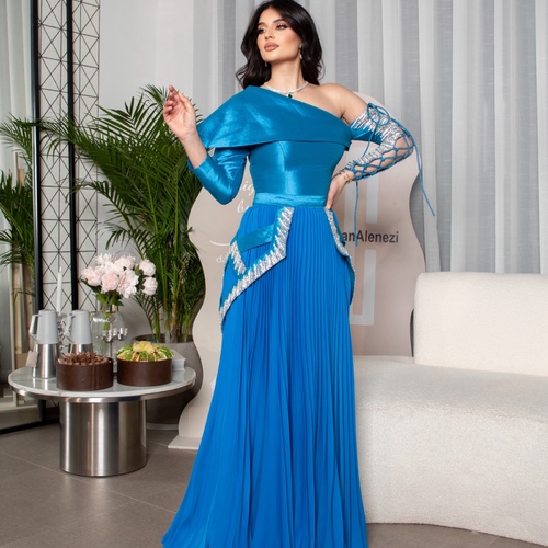 blue blessy tafta _ barbi - A blue dress made from taffeta and Barbie pleats, adorned with traditional Bedouin-style handwork featuring Belgian crystals.