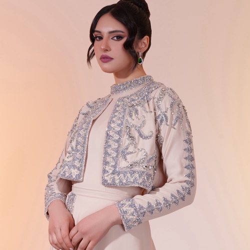 Cream plessy chiffon jacket. - A luxurious Angelina crepe jacket adorned with crystals and pearls. This exquisite piece is intricately crafted and costly, featuring pleated chiffon in a creamy color and lined with Valentino silk.