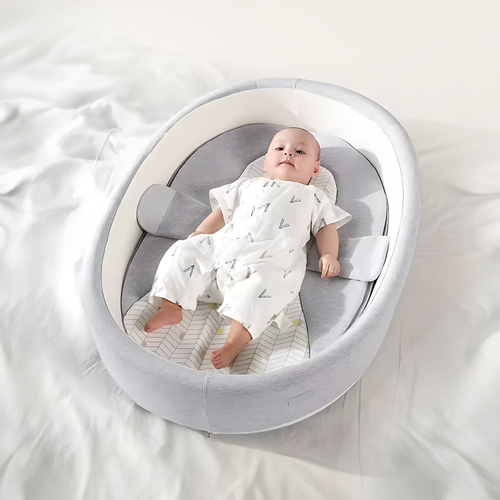 Portable Newborn Bed - Portable Newborn Bed Made from high-quality foam   And 100% cotton fabric   Mattress designed for excellent ventilation   Lightweight, portable, and easy to fold   Includes a zip-up bag for travel   Washable cover   Bed dimensions: 53×36×23 cm   Weight: 2.8 kg   Safety barrier with a height of 15 cm to prevent adults   From rolling onto the baby   Suitable for newborns   Up to 10 months old