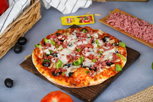 Mortadella Pizza - Experience savory perfection with our Mortadella Pizza,featuring a thin, crispy crust, tangy tomato sauce, melted cheese, and generous slices of delectable mortadella,for a pure culinary delight.