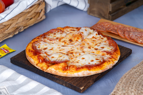 Pepperoni Pizza - Made with a classic tomato sauce, mozzarella cheese, and sliced pepperoni, it's a perfect meal for pizza lovers who want a classic and delicious pizza.