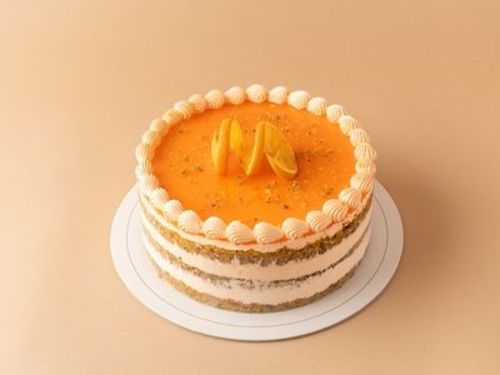 orang cake - layers for orange spong cake and cream with orang freesh