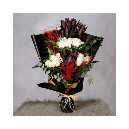 Lucene - Tyler 13 - Height: 67cm
Width: 30cm
Hand bouquet containing assorted flowers.