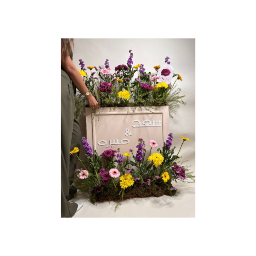 A Large Wooden Box Arranged With Elegant Natural Roses, With a Congratulation Card and Names Written - A large wooden box arranged with elegant natural roses, with a congratulation card and names written