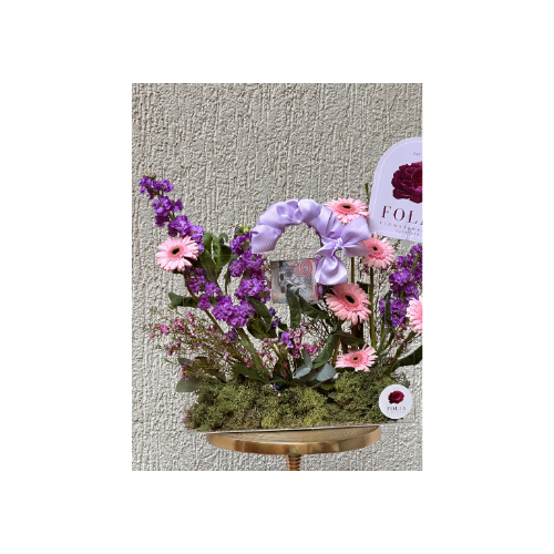 A Stand of Natural Flowers in Elegant Violet Shades, With a Greeting Card and Acrylic - A stand of natural flowers in elegant violet shades, with a greeting card and acrylic