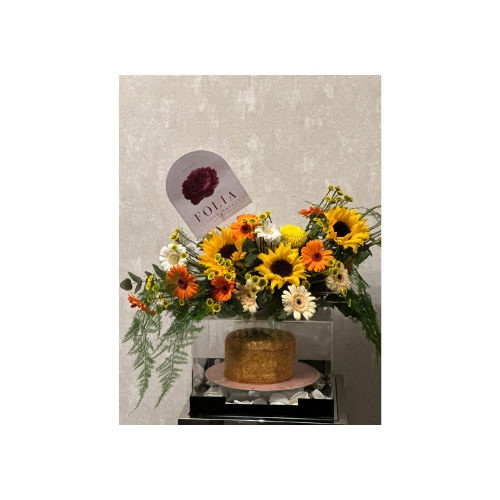 An Acrylic Box Containing a Birthday or Special Occasion Cake Covered With Natural Roses - An acrylic box containing a birthday or special occasion cake covered with natural roses