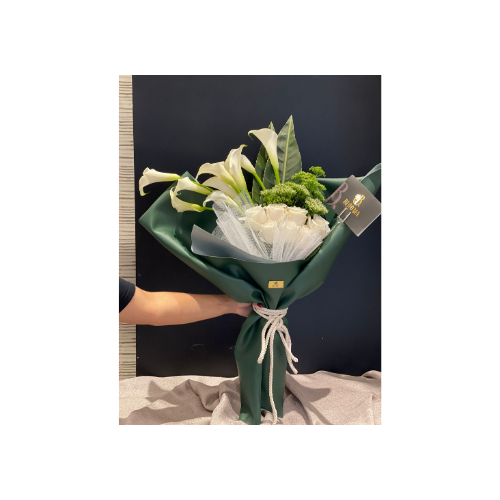 A Rose Bouquet With Natural Tulips - A rose bouquet with natural tulips, wrapped in natural leather and a modern tie. Suitable for all occasions.