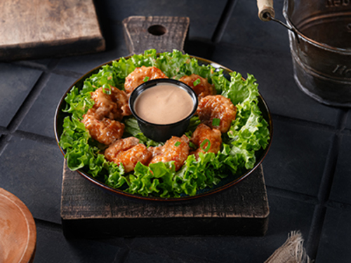 Dynamite Shrimp - Dynamite shrimp battered and deep fried shrimps golden perfection and tossed with a dynamite-mayonnaise light dressing.
