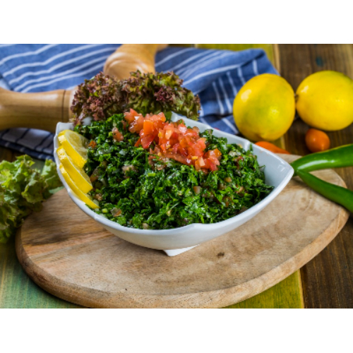 Tabbouleh - Knife chopped parsley, tomato, spring onion, mint, with cracked gorats, olive oil and fresh lemon juice.