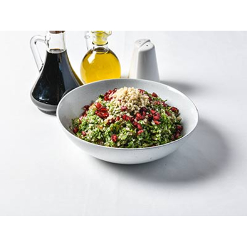 Quinoa Tabbouleh - White quinoa mixed with fresh parsley, tomato, spring onion, mint and pomegranate seeds, with olive oil and fresh lemon juice.