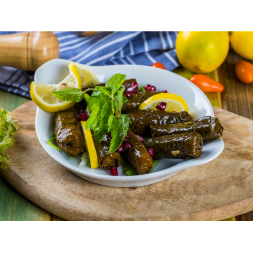 Grape Leaves - Rolled grape leaves stuffed with rice, tomato, parsley, onion, olive oil and fresh lemon juice.