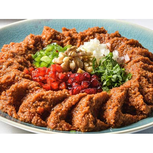 Muhammara - Blend of bread crumbs, mashed chili peppers, walnuts, pomegranate molasses spices and olive oil.