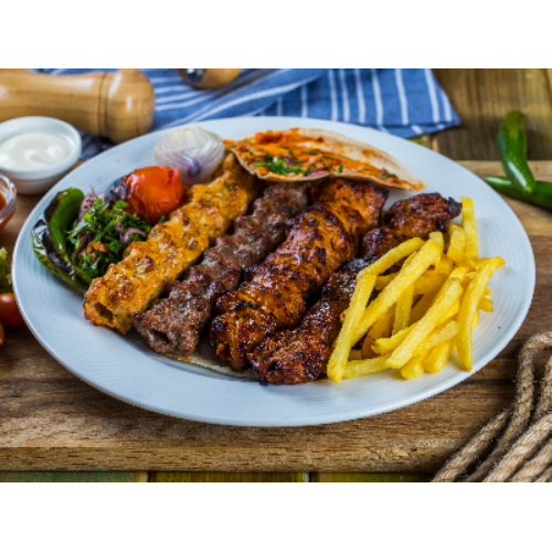 Saraya Mixed Grill - A selection of 1 shish tawook, 1 veal kebab, 1 chicken kebab, 1 meat kebab and served with French fries.