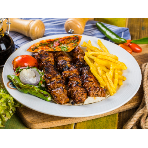 Lamb Cuts - Pieces of tenderloin veal fatayel with special spices grilled on charcoal and served with potato chips