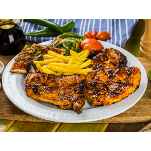 Grilled Half Chicken - Whole, charcoal grilled, chicken, served with french fries, tomato and garlic sauce.