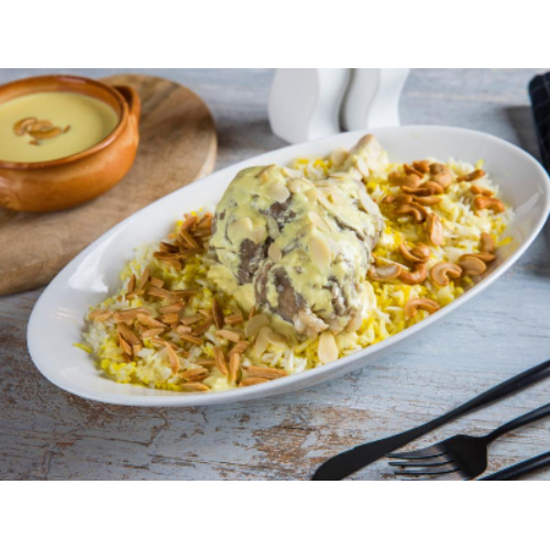 Syrian Mansaf With Mouzat - A piece of lamb cooked with fine jameed, served with mansaf rice