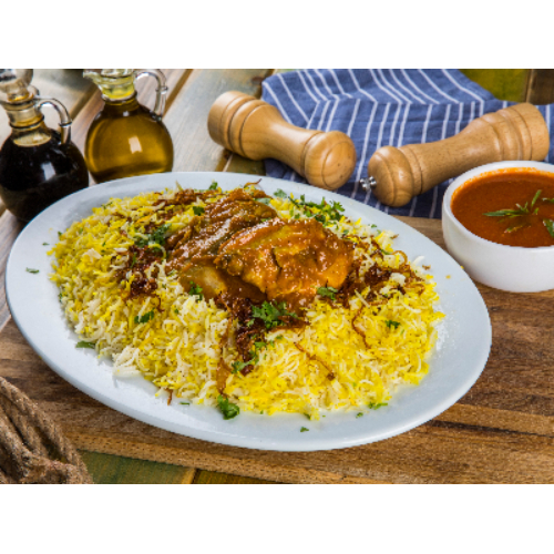 Chicken Biryani - Basmati rice with chicken pieces and gravy.