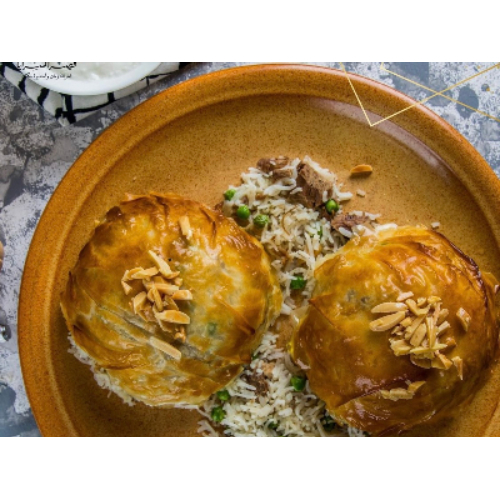 Shami Ouzi - Mix of rice green peas with nuts meat stuffed in crispy dough